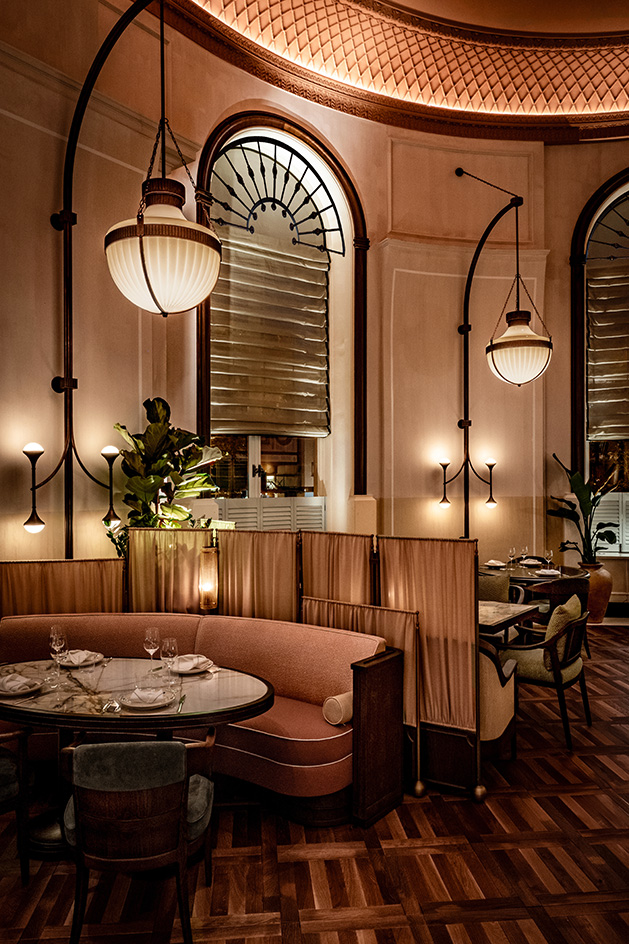 interior of Mezzogiorno by Afroditi in moody light and warm red and brown tones