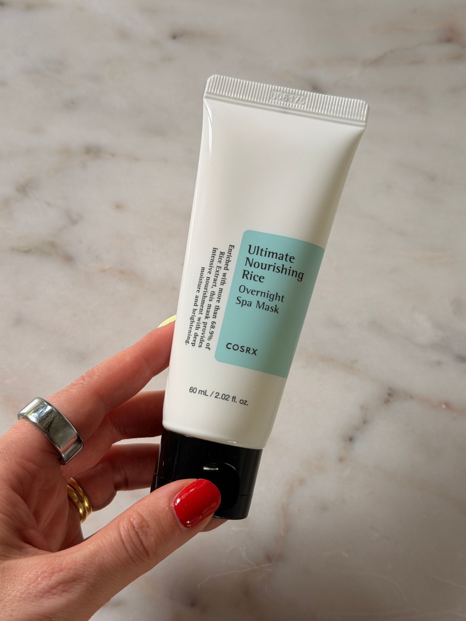 Freelance beauty editor Grace Day holding the COSRX face mask
