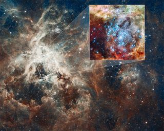 This is a Hubble Space Telescope image of a pair of star clusters that are believed to be in the early stages of colliding. The clusters lie in the gigantic 30 Doradus Nebula, which is 170,000 light-years from Earth. Image released August 16, 2012.
