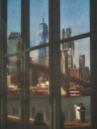 New york skyline and Brooklyn bridge reflected in glass window