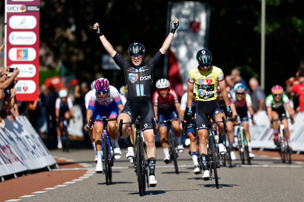 GENNEP NETHERLANDS SEPTEMBER 01 Charlotte Kool of Netherlands and Team DSM celebrates at finish line as stage winner Georgia Baker of Australia and Team BikeExchange Jayco and Lorena Wiebes of Netherlands and Team DSM Yellow leader jersey during the 25th Simac Ladies Tour 2022 Stage 3 a 1391km stage from Gennep to Gennep SLT2022 UCIWWT on September 01 2022 in Gennep Netherlands Photo by Bas CzerwinskiGetty Images