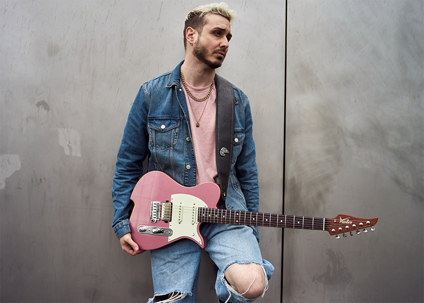Pierre Danel holds his new Vola signature Vasti PDM J2 guitar