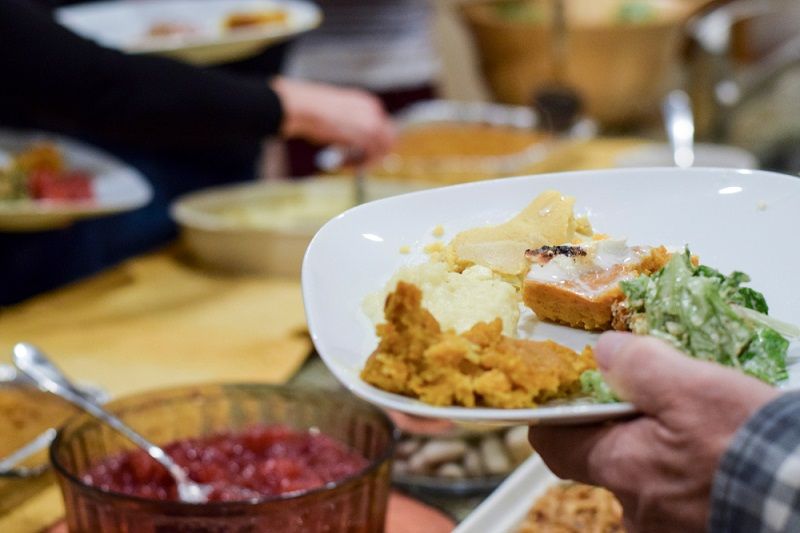 A person serving themselves a holiday meal.