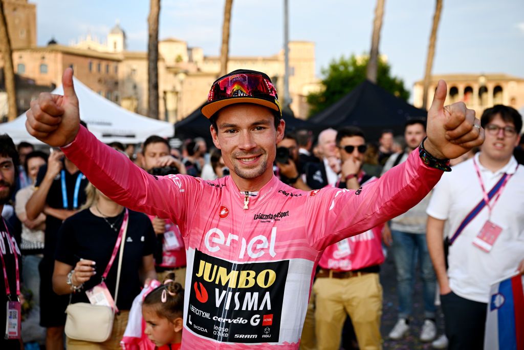 ROME ITALY MAY 28 Primo Rogli of Slovenia and Team JumboVisma Pink Leader Jersey celebrates at podium as overall final race winner during the 106th Giro dItalia 2023 Stage 21 a 126km stage from Rome to Rome UCIWT on May 28 2023 in Rome Italy Photo by Stuart FranklinGetty Images