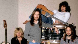 Status Quo posing for a photograph backstage at a gig in the mid-70s