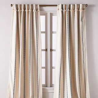 Pieced Stripe Cotton Blend Woven Blackout Curtain over a window against a white wall. 