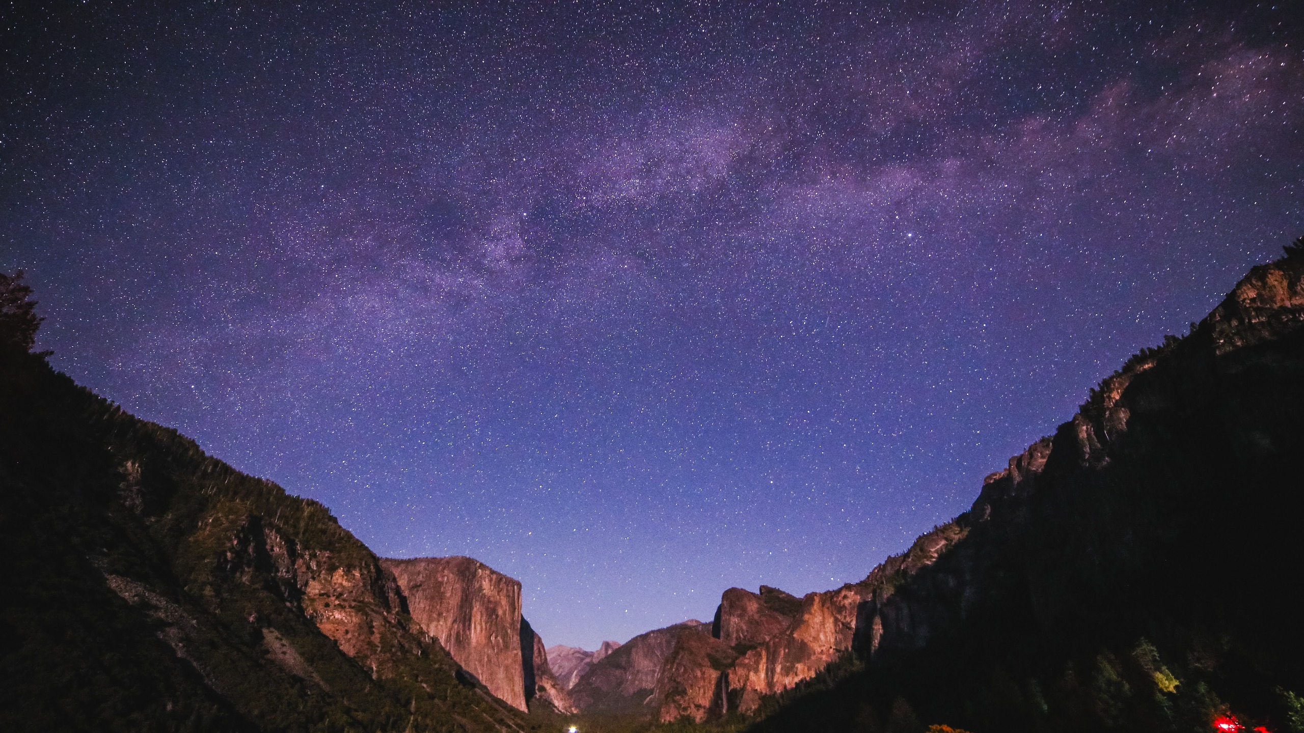 milky way stretching across the sky above impressive rock formations