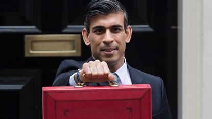 Rishi Sunak holding his budget case