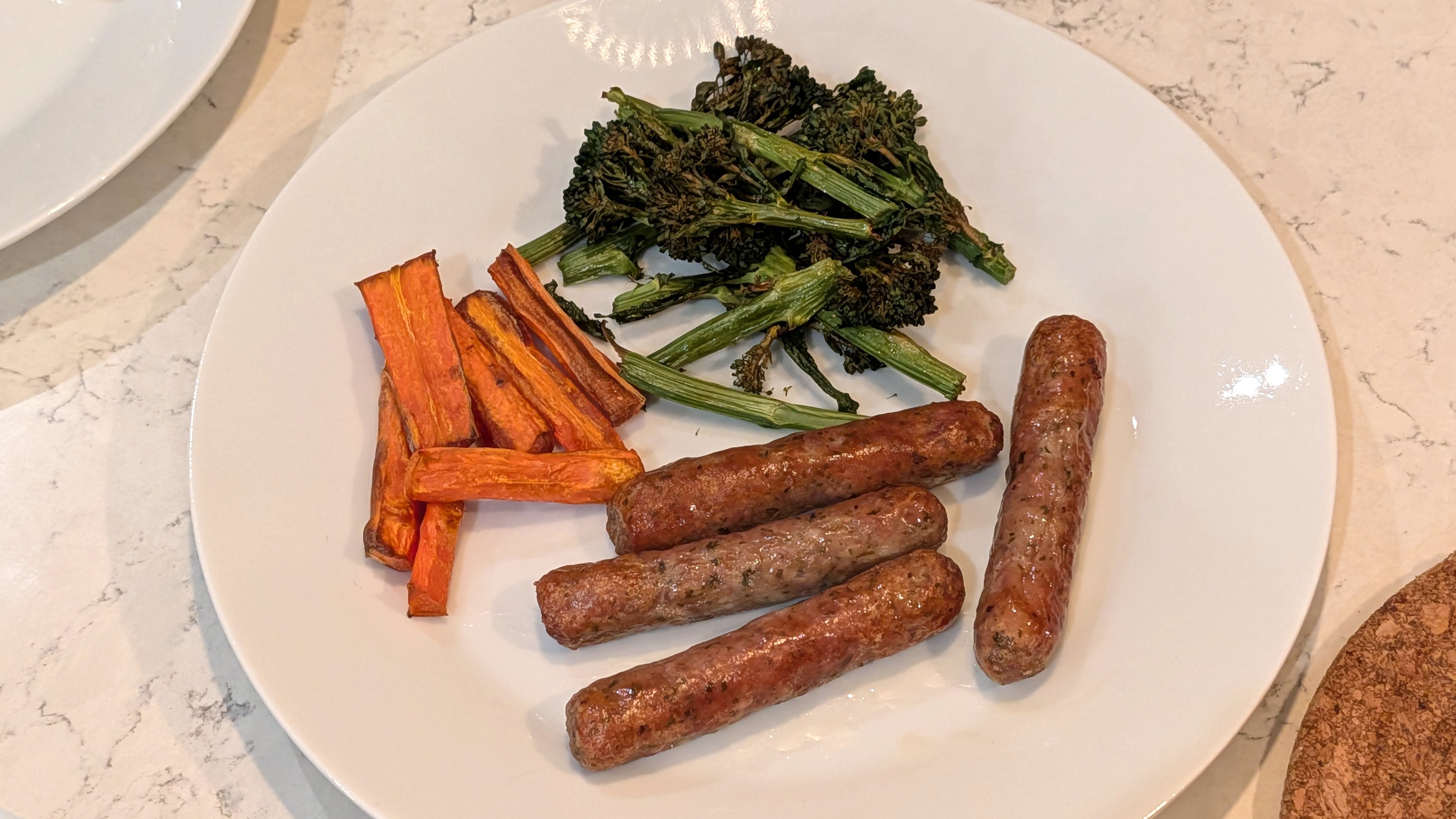 Broccoli, carrots, and sausages cooked using Philips 4000 Series Airfryer on plate