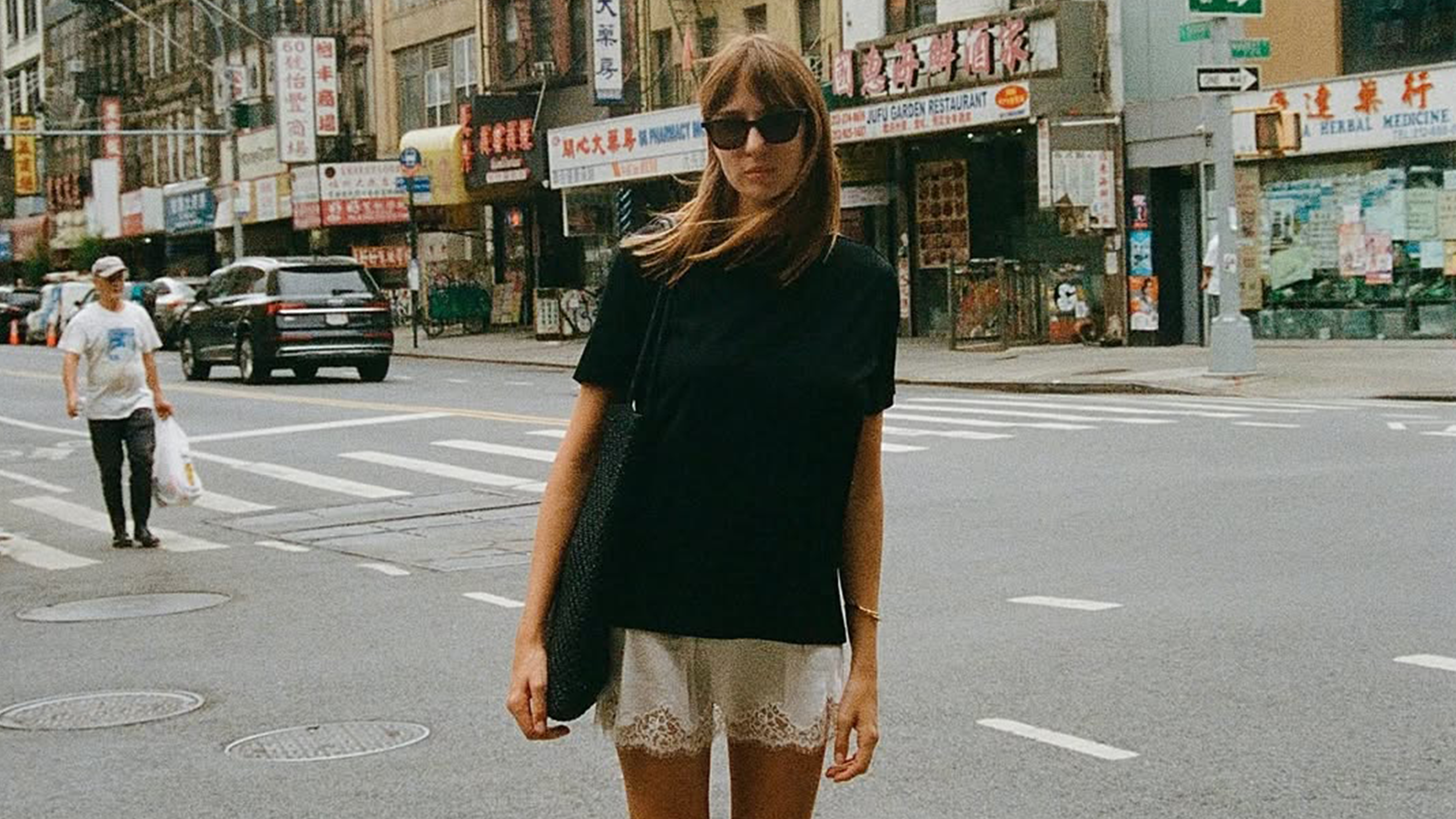 Lizzy Hadfield wearing lace shorts and tall boots
