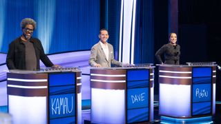 W. Kamu Bell, David Friedberg and Robin Thede behind Jeopardy podiums on Celebrity Jeopardy