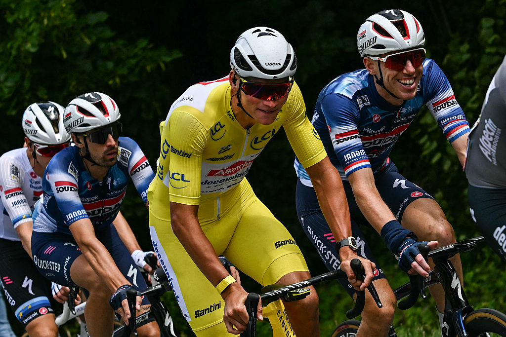 Alpecin - Deceuninck team's Dutch rider Mathieu van der Poel (C) wearing the overall leader's yellow jersey cycles alongside Soudal Quick-Step team's Dutch rider Pascal Eenkhoorn (R) during the 3rd stage of the 112th edition of the Tour de France cycling race, 178.3 km between Valenciennes and Dunkerque (Dunkirk), Northern France, on July 7, 2025. (Photo by Loic VENANCE / AFP) (Photo by LOIC VENANCE/AFP via Getty Images)
