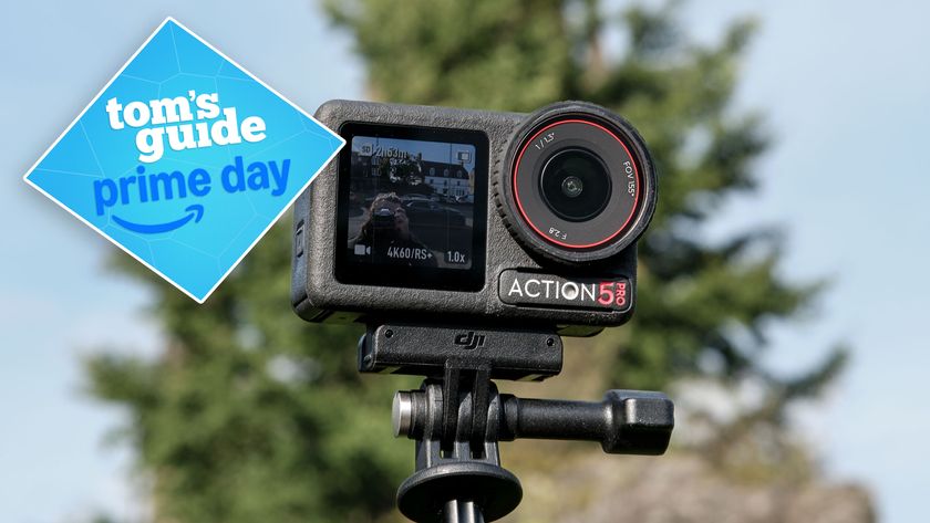 DJI Osmo Action 5 Pro against a blue sky with a tree in the background. A Tom&#039;s Guide Prime Day badge is on the left of the image.