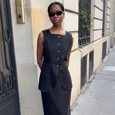 woman in black linen vest