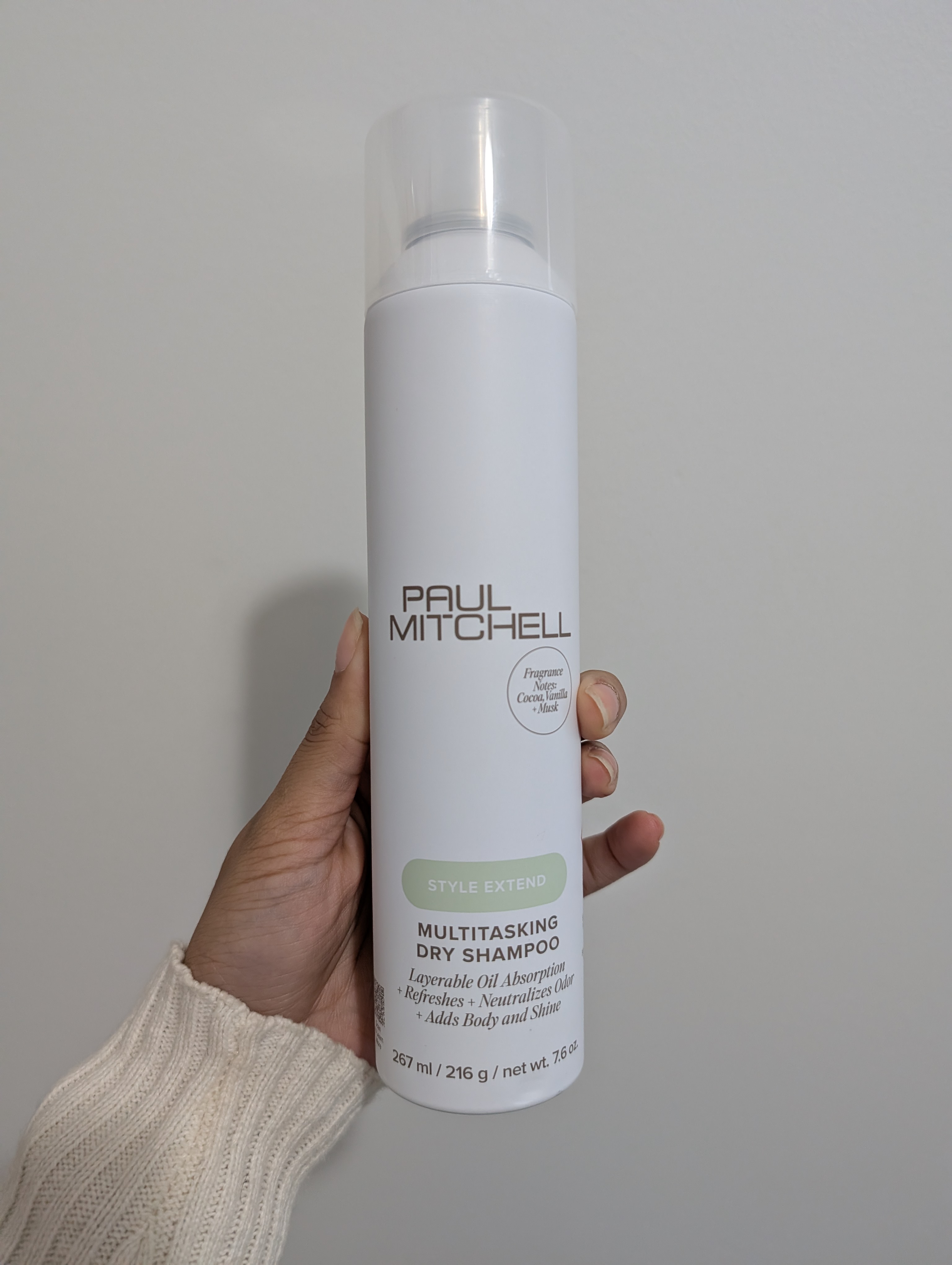 Photo of tester holding the Paul Mitchell Multitasking Dry Shampoo