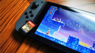 Nintendo Switch with Super Mario Wonder on screen