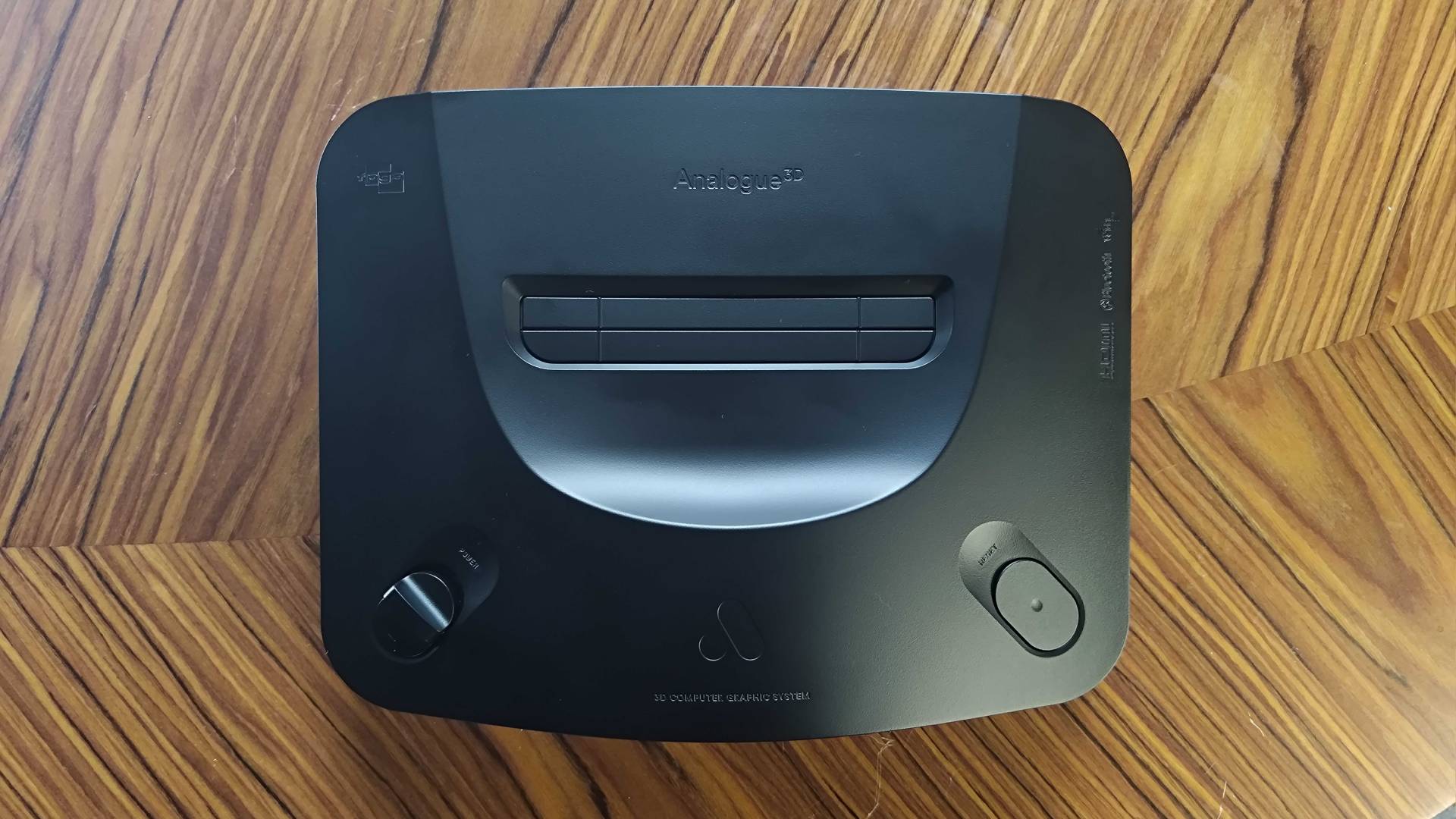 Top view of Analogue 3D on woodgrain table.