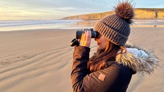 author Kimberley Lane looking through the Hawke Frontier ED X 8x42