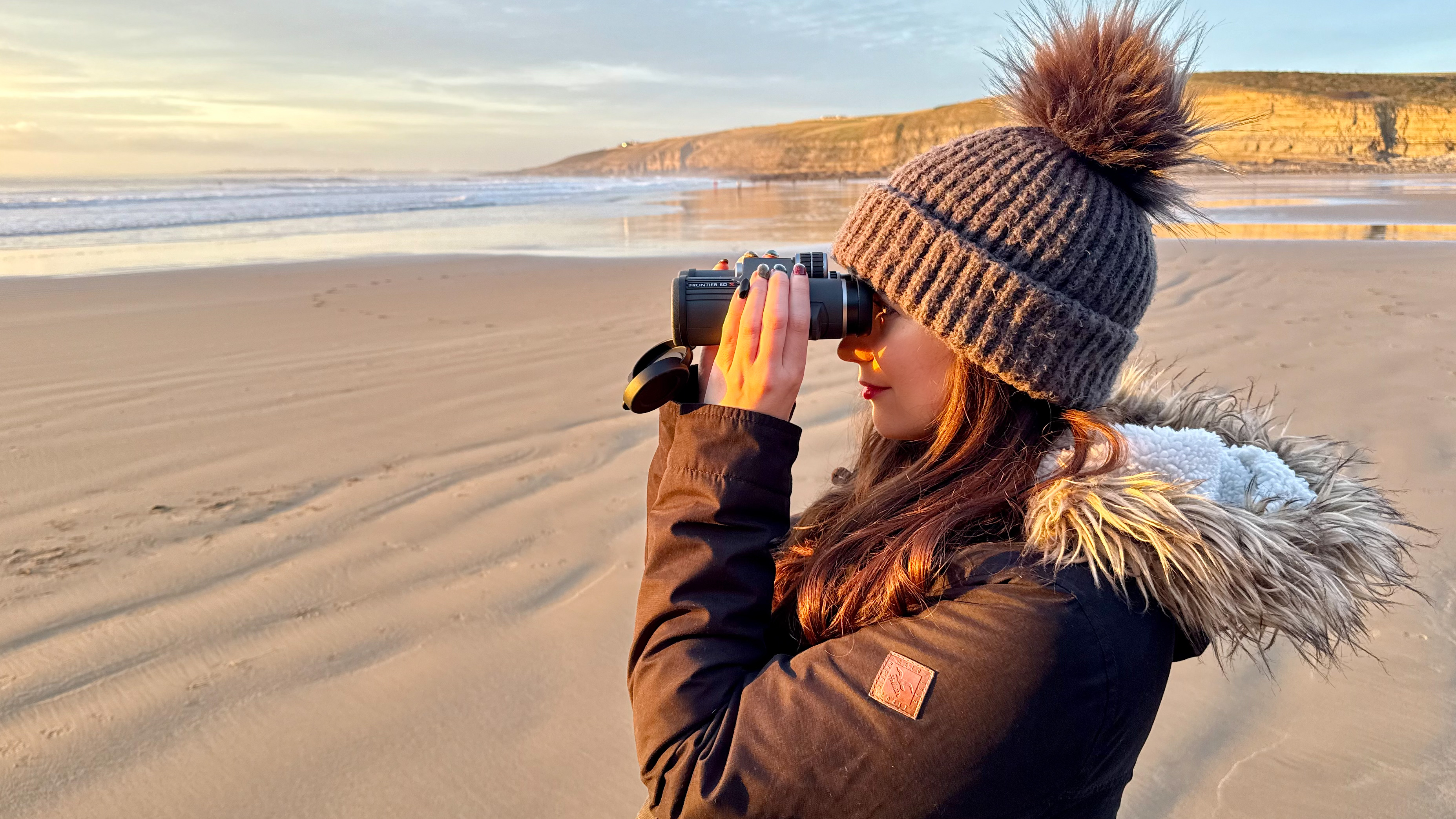 author Kimberley Lane looking through the Hawke Frontier ED X 8x42