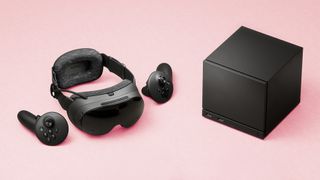 Valve Steam Frame VR headset and Steam Machine mini gaming PC on a faded magenta background