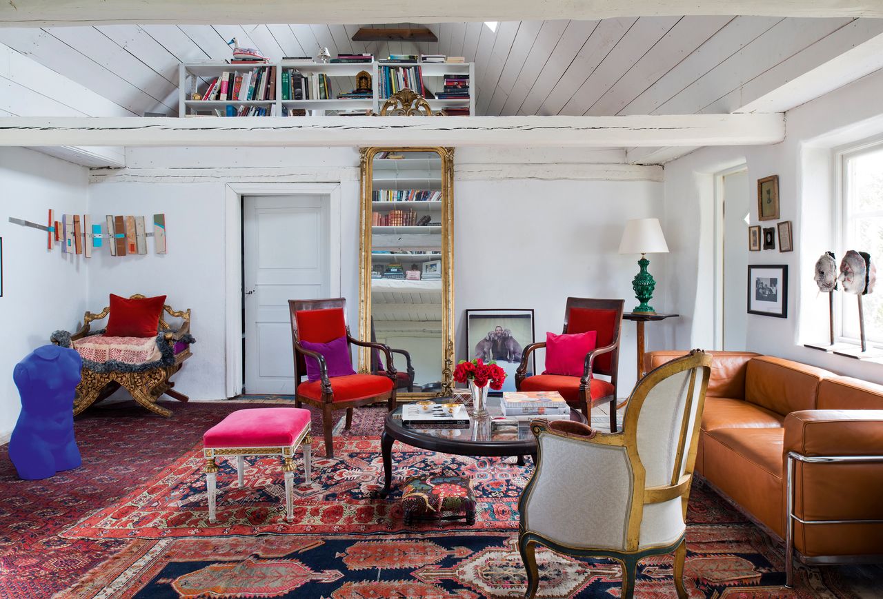 living room detail with red sofas and armchairs