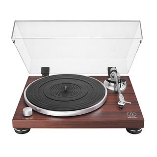 Audio Technica AT-LPW50BTRW turntable in rosewood finish with lid on white background