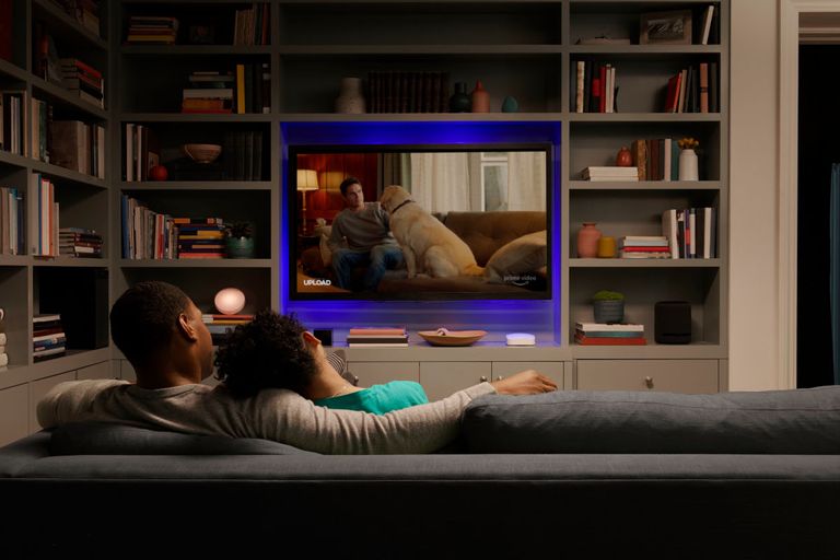 Couple watching a movie streamed over Wi-Fi on the couch