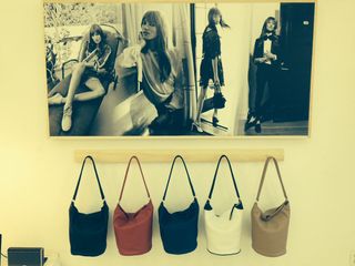 Newbark bags hanging below images styled by Maryam
