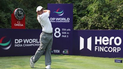 Rory McIlroy holds his finish on his tee shot on the 8th hole during a practice round at the DP World India Championship