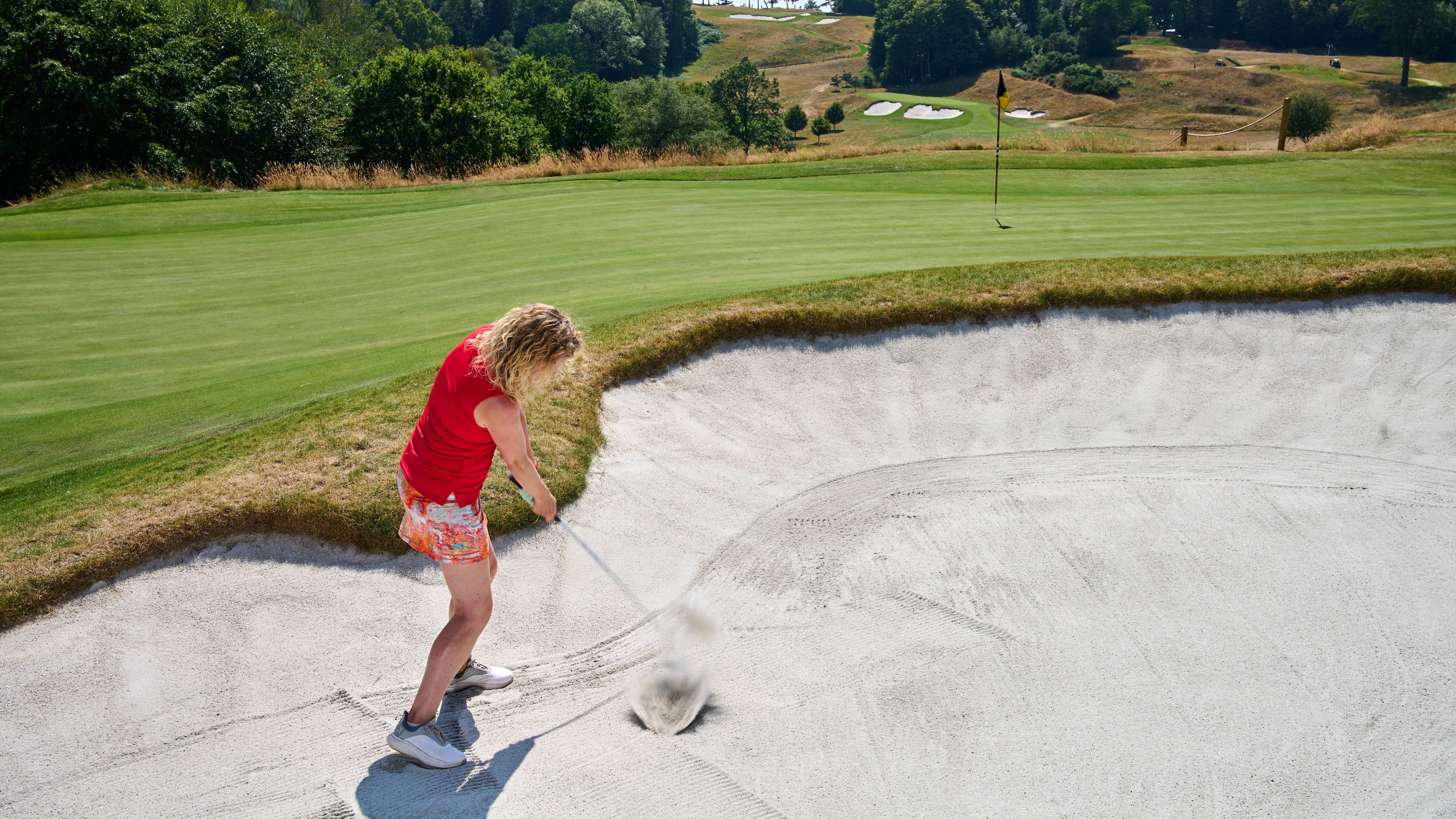 Katie Dawkins playing a bunker shot