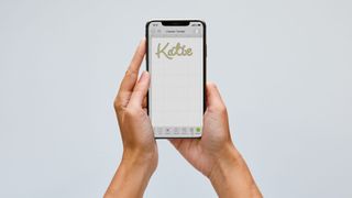 A font is see in Cricut Access being used on a mobile phone