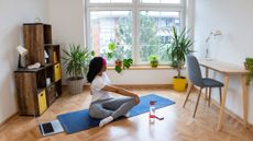 Person practicing yoga at home