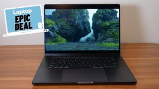 Apple M4 Pro MacBook Pro 16 laptop on a wooden desk with white background and epic deal Laptop sticker.