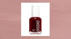 A close up of essie's nail polish in shade Bordeaux/ in a dark pink template