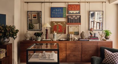 A jewelry shop designed with warm woods cabinets juxtaposed with see-through wrought iron and glass boxes, colorful ceramics and artworks, and eye-catching textiles.