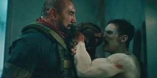 Dave Bautista fighting a zombie in Army of the Dead.
