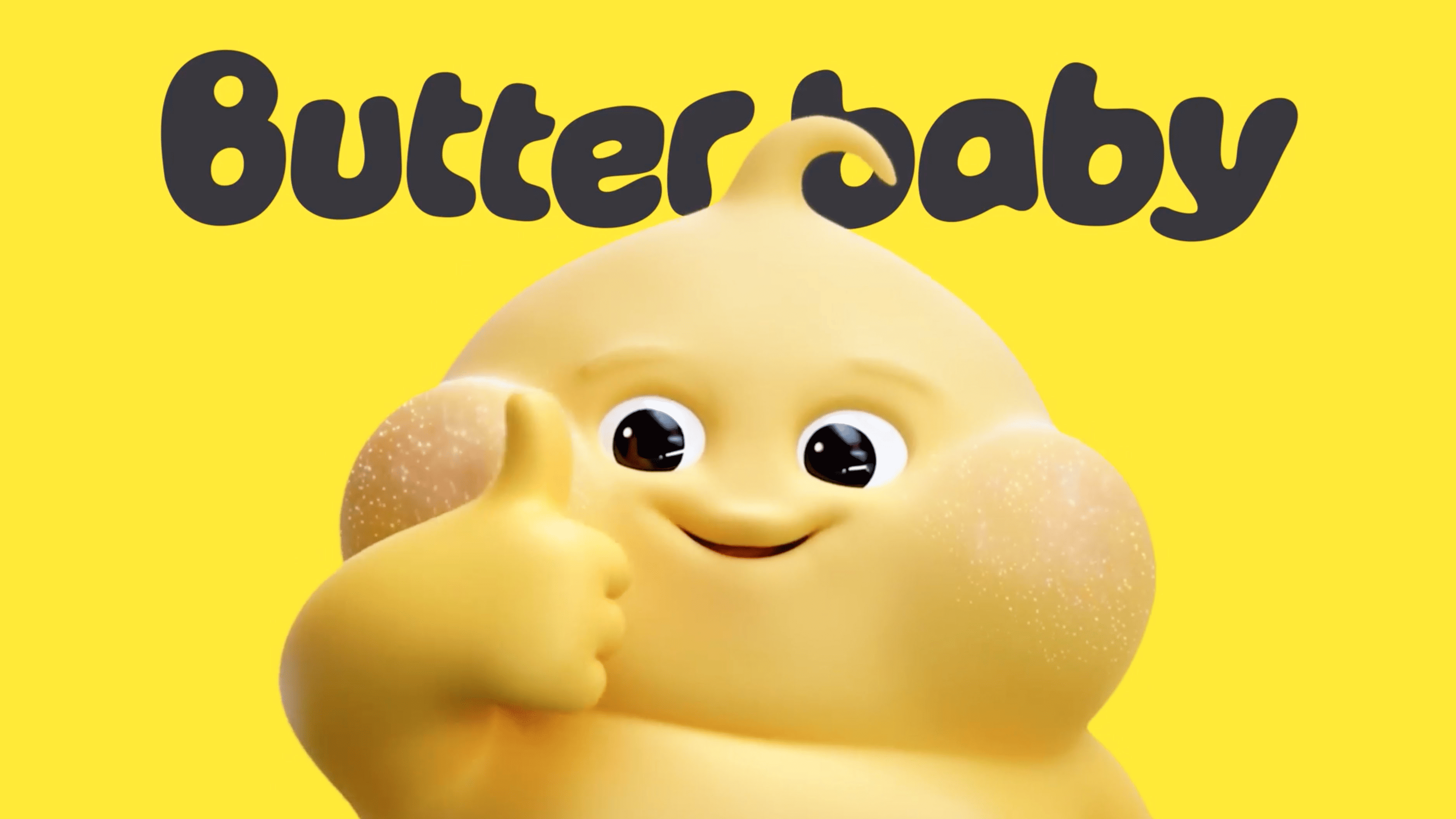 A cheerful, round yellow character with a thumbs-up gesture appears beneath the bubbly, dark text "Butter baby" on a bright yellow background.
