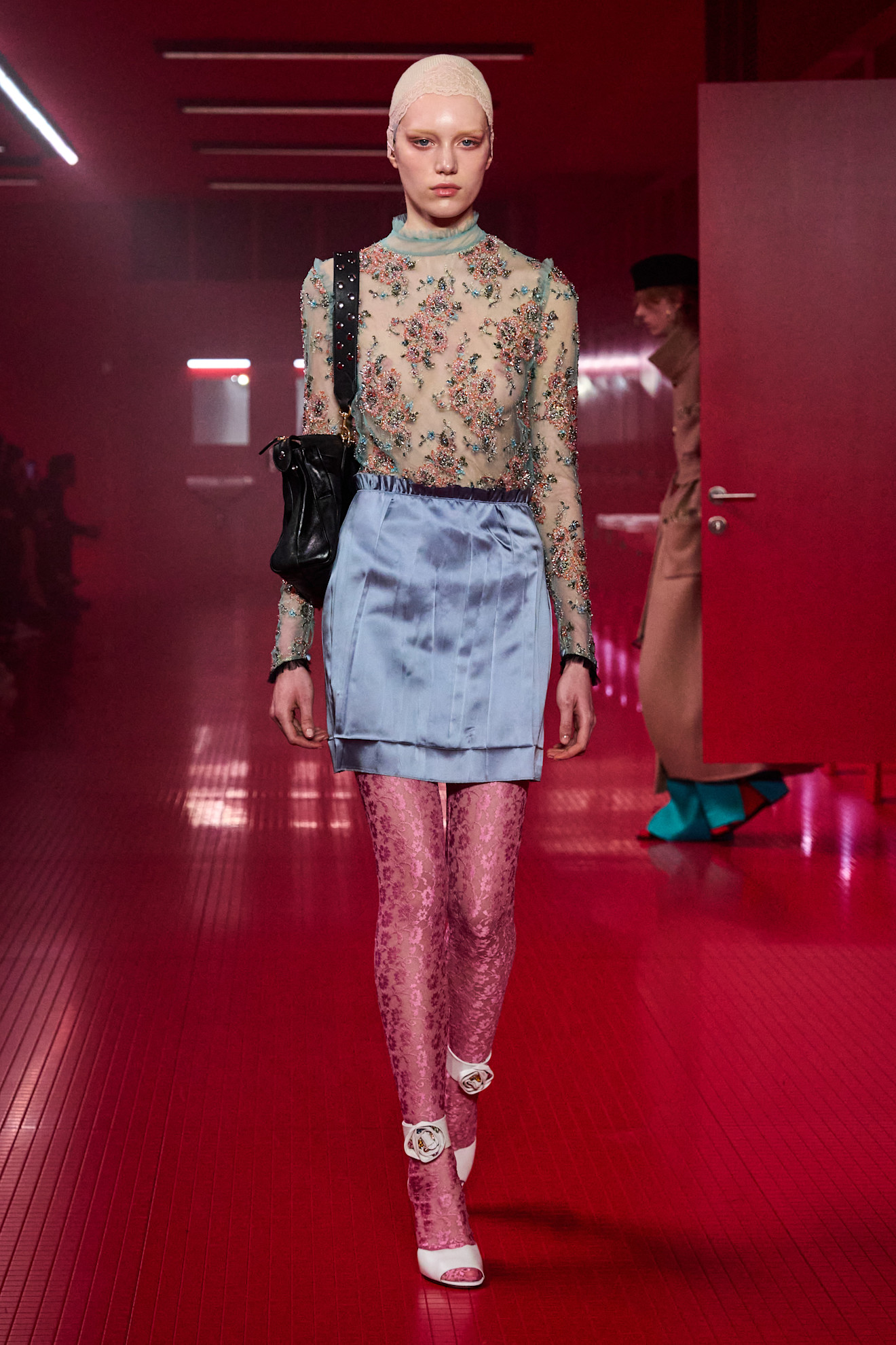 Model wears the baby blue color trend on the runway.