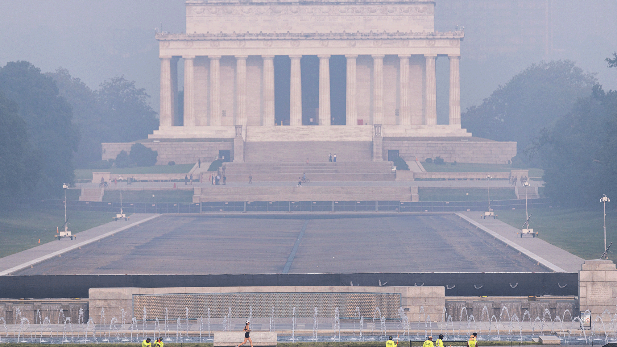 A smoky view of the Lincoln memorial, a large pillared building.