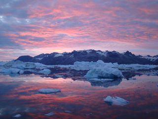 Icebergs melt in a Greenland Fjord as pink clouds reflect in the water. "t’s hard to describe the beauty and inspiration of the places in which we work," said photographer and glaciologist Tavi Murray." I am a scientist rather than an artist or photographer but a landscape like this talks directly to my soul."