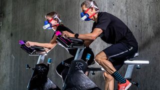 People wearing VO2 Master face mask while cycling on indoor bikes