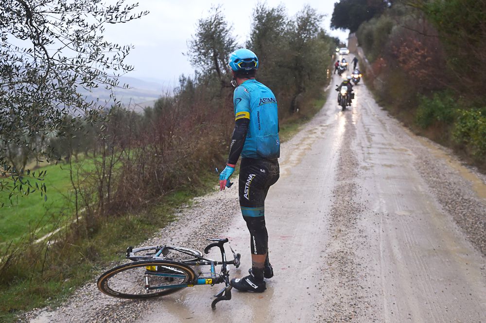 Truis Korsaeth waits for assistance at Strade Bianche