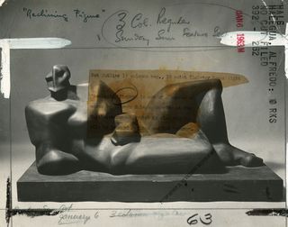 Vintage mid-century press photo featuring artwork of a man lying on a couch and markings on the back of the photo