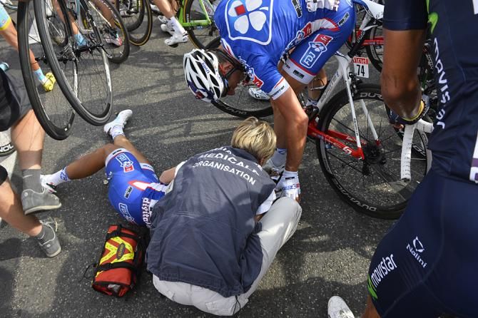 Nacer Bouhanni gets medical attention after crashing in Marseille