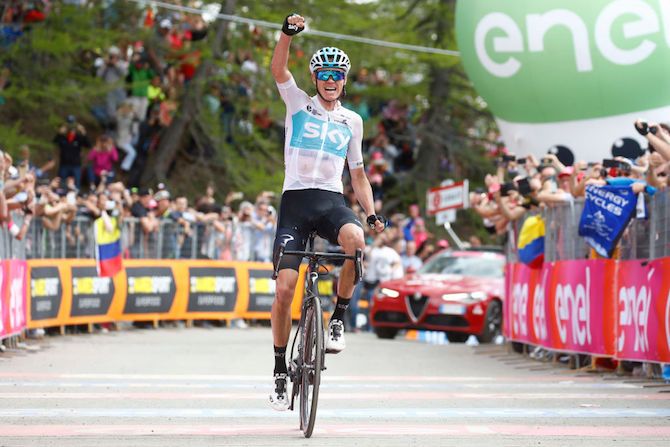 Team Sky's Chris Froome punches the air in delight on top of Monte Jafferau having won stage 19 of the Giro