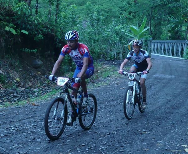 Disqualified rider Luis Mejia leads Sam Schultz after the two got into an early breakaway.