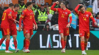 Gareth Bale celebrates with Wales team-mates after taking the lead against Ukraine.
