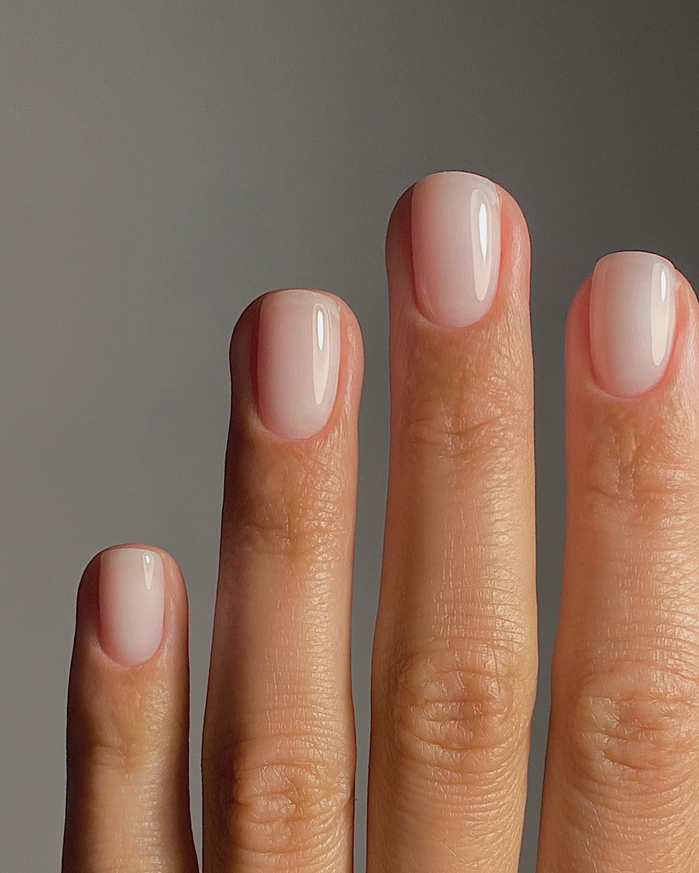 Close up of a milky white gel manicure
