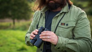Leica trinovid in hand