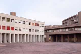 Monte Amiata, Gallatese II in Milan, Italy - a multi-story concrete building in cream and grey/brown